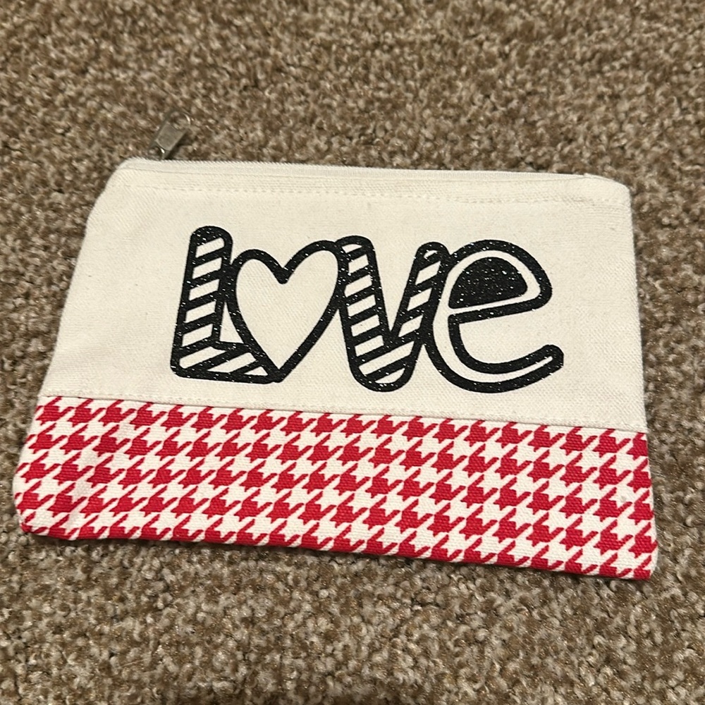 Brand new valentine zipper pouch! Perfect for storing small items.